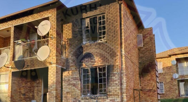 Two bodies were discovered after firefighters contained a blaze at an apartment block in Alberton in the early hours of Wednesday morning.