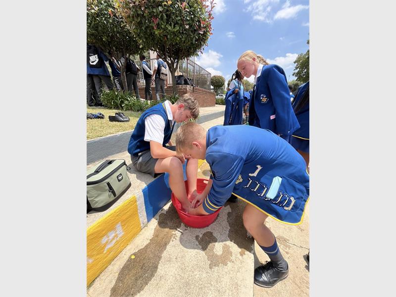 The feet washing ceremony at the school symbolises service, respect and caring.