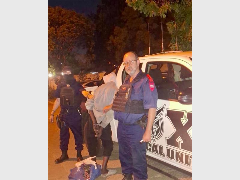 The officers found the suspect in possession of stolen goods and armed with a knife.