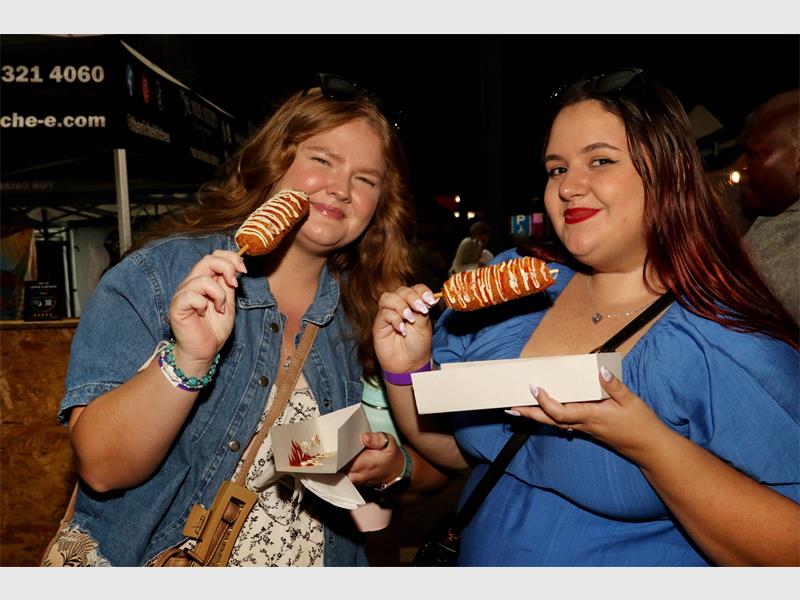 Local artist Michayla Rouse and food vendor Kyle Richardson were among those showcasing their talents at the bustling weekend market.