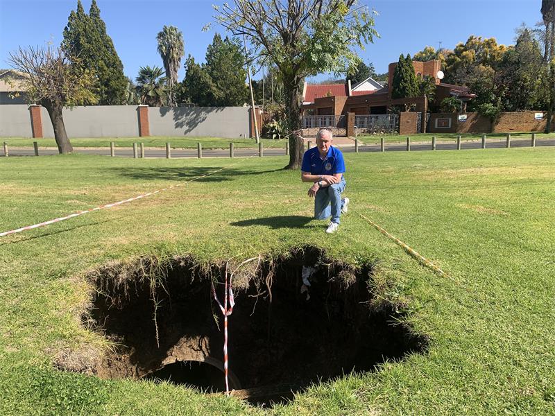 Residents in Alberante Security Village say a growing sinkhole that has remained unrepaired for months poses a serious danger to children, pets and the public, with the community forced to cordon off the area themselves.