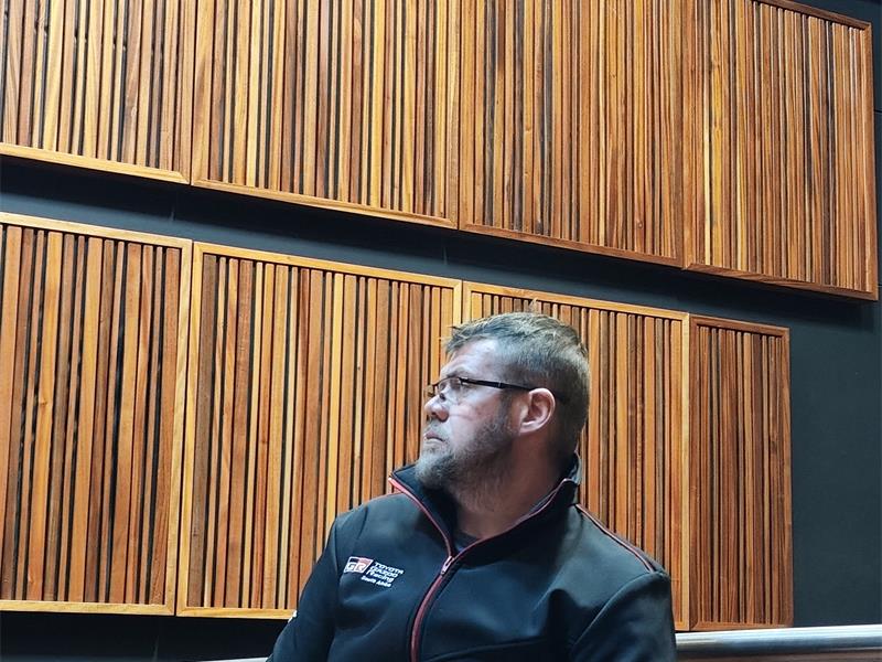 The first witnesses described finding two men fighting over an axe, victims inside the home and a series of panic alarms before the trial was postponed to August 5.