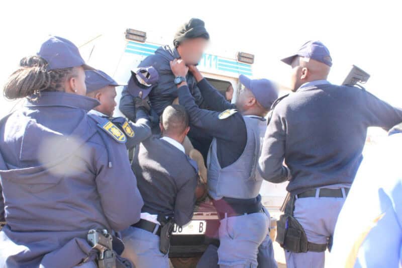 Tensions have escalated in Greenfields after a community leader involved in anti-illegal immigration protests was shot on this morning, prompting another march that later descended into clashes between residents and police.