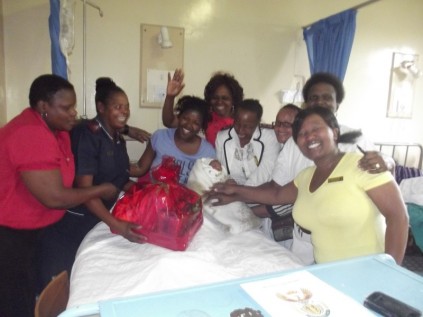 Mother of the baby born on Christmas Day, Siphokazi Chimi, is surrounded by South Rand Hospital staff, B Memela, E Sefora, C Thloaele and J Netshongole (professional nurses) and N Mahlaba, N Chauke and M Khoza (general assistants).