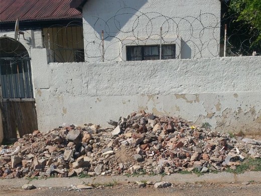 RUBBLE: Building bylaws are being ignored in Regents Park. On the corner of Augusta Road and Marjorie Street building rubble is seen on the pavement.
