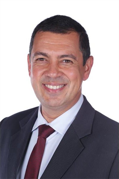 Nicholas Riganias Principal Gary Norton hands reins to Regan Nicholas | Southern Courier