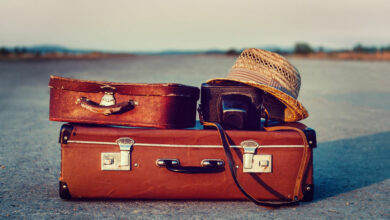Suitcases on road