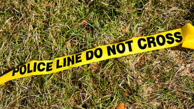 Police line do not cross on grass.