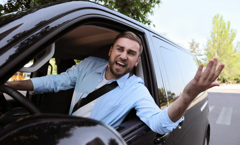 Emotional man in car. Aggressive driving behavior