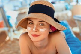 Woman,Smile,Applying,Sun,Cream,On,Face.,Skincare.,Body,Sun