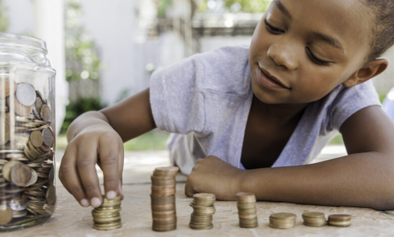 Young girl counting her coins.