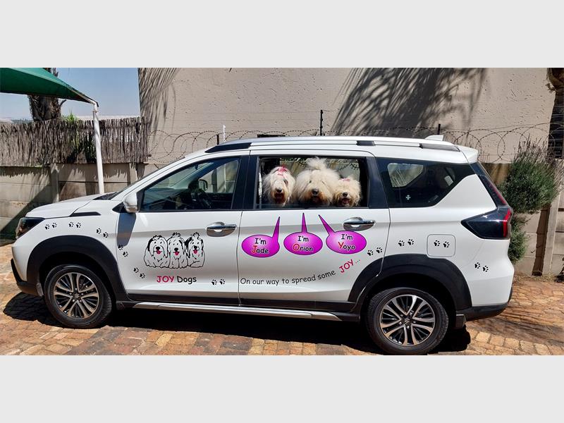 The dogs are thrilled with their spacious new ride and ready for many happy journeys ahead.