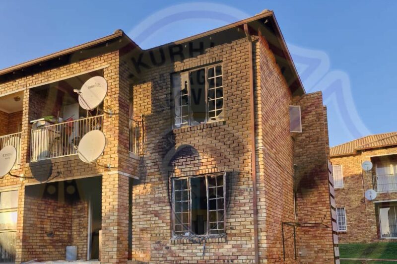 Two bodies were discovered after firefighters contained a blaze at an apartment block in Alberton in the early hours of Wednesday morning.