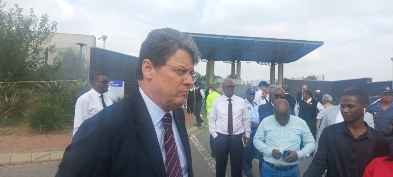 Deputy Minister Nel says gunmen opened fire outside the court as the accused exited after a pretrial conference.