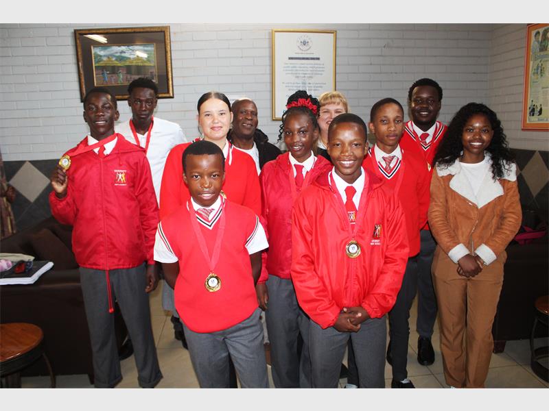 The principal and both coaches congratulated the learners.