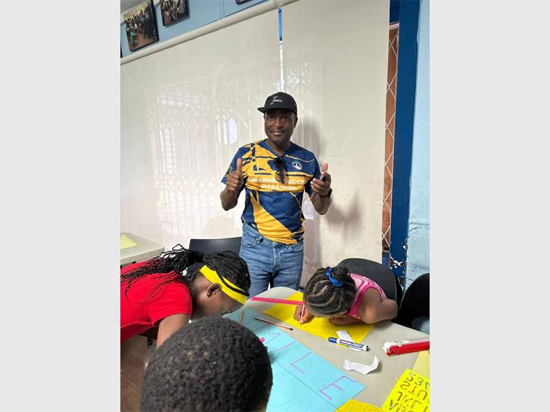 Special signs and smiles will line the R82, as community supports big race.