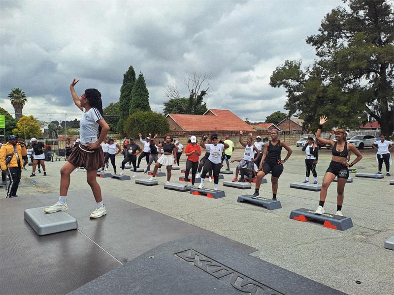 Move with Mike event unites aerobics teams & community leaders in celebration.