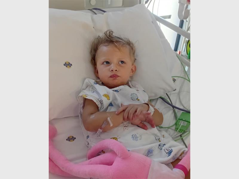 The family of 22-month-old Abigail Kamffer is appealing for financial assistance as the brave toddler undergoes treatment for lymphoblastic lymphoma after a tumour on her spine left her unable to walk.