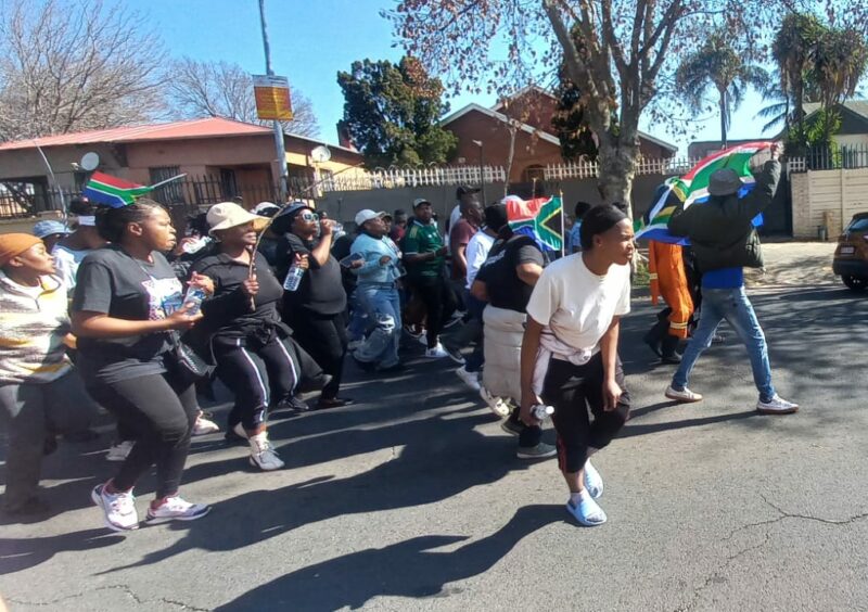 Marchers move through Verona Street, Prairie Street and Regents Park under police monitoring before concluding their demonstration at JC Lucas Park opposite the post office.
