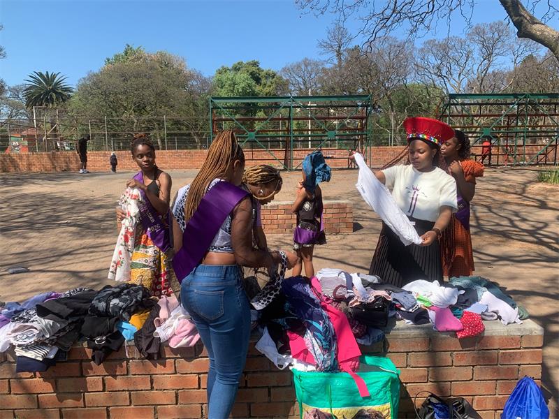 The academy’s organising team and current finalists distributed sandwiches and clothing to community members in need during the outreach initiative.