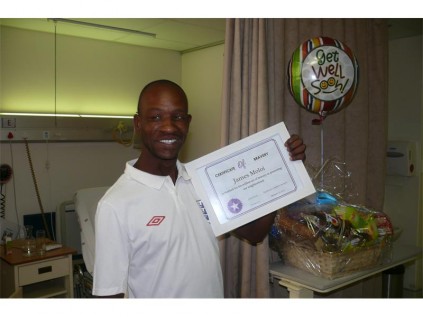 James Moloi, receiving his certificate for barvery.