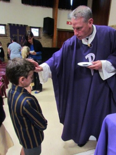 Being blessed with ash at the beginning of Lent.