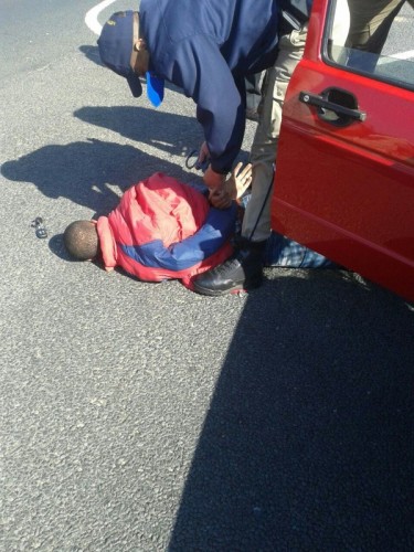 A police officer makes an arrest.