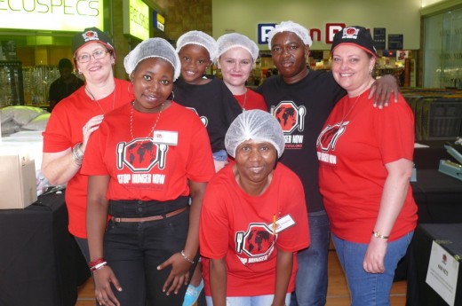 Stop Hunger Now volunteers, front: Adolphina Bokaba. Back: Dawn Troskie, Tania Bokaba, Imani Dube, Shekaila Troskie, Ntuthuko Dube and Louise Els.       
