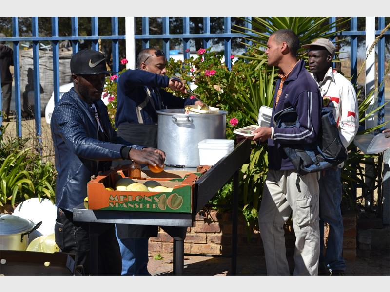 Less Fortunate Giving Little ones give food to the less fortunate | Comaro Chronicle