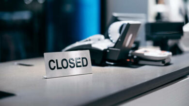 Closed sign on checkout counter, store cashier counter not in service