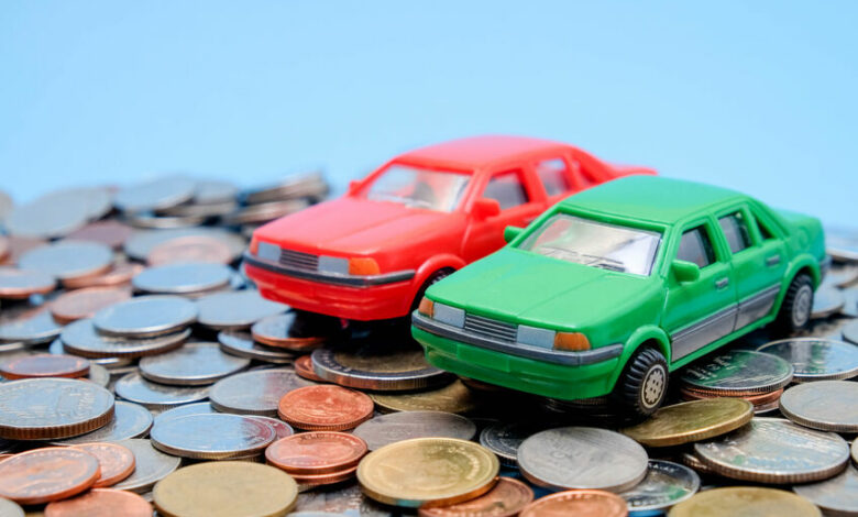 save money for investment concept Toy car and stack of coins