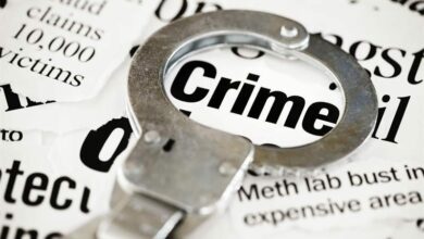 Handcuffs on newspaper.