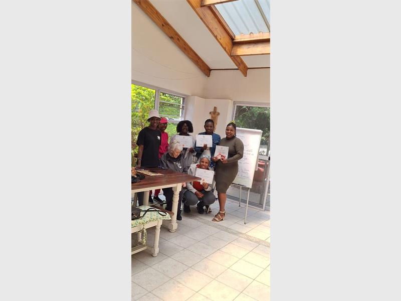 After a year of dedication, four mothers proudly move on to the next level in their language learning journey.