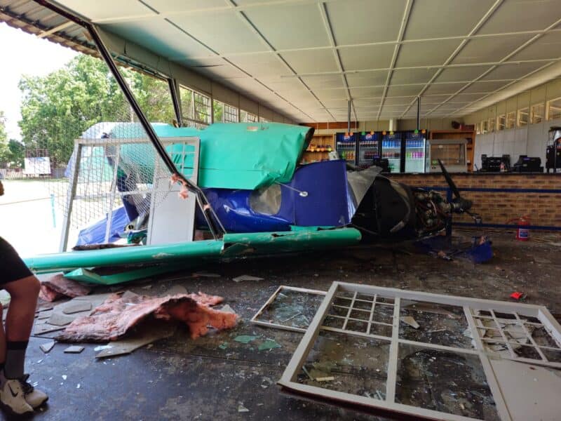 The instructor and student escaped uninjured after the light aircraft crashed into the school tuckshop.