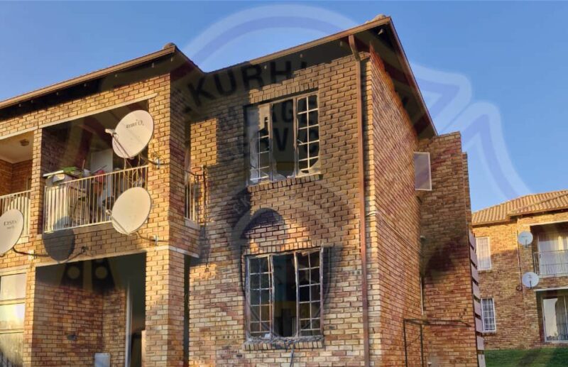 Two bodies were discovered after firefighters contained a blaze at an apartment block in Alberton in the early hours of Wednesday morning.