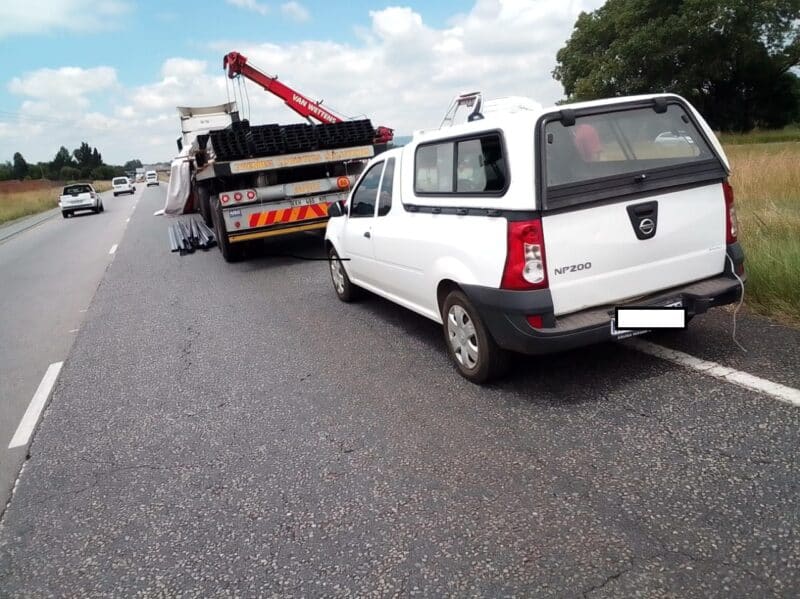 A metal load from a truck spills onto the roadway, forcing lane closure and heavy traffic congestion; EMPD urges caution and alternative routes.