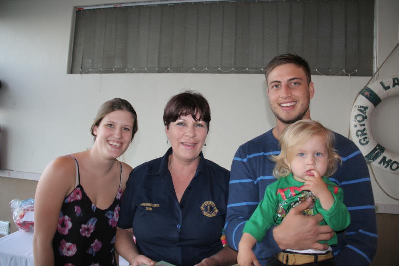 Mandy Roux congratulates Chayt Daniels and his parents Bronwynne and Tyrone.