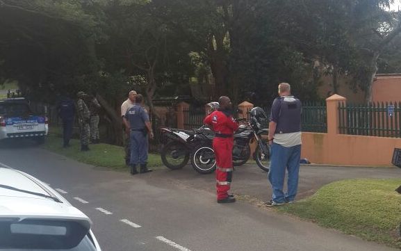 Police and response officers deal with the thief caught breaking into a vehicle in Dan Pienaar Drive.