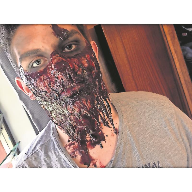 Zandelee Terblanche's Halloween-inspired special effects make-up on her friend, David Fourie.