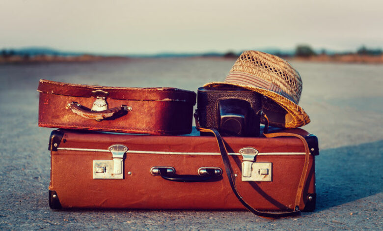 Suitcases on road