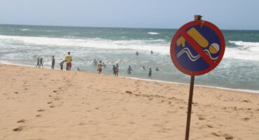 no swimming sign at the beach