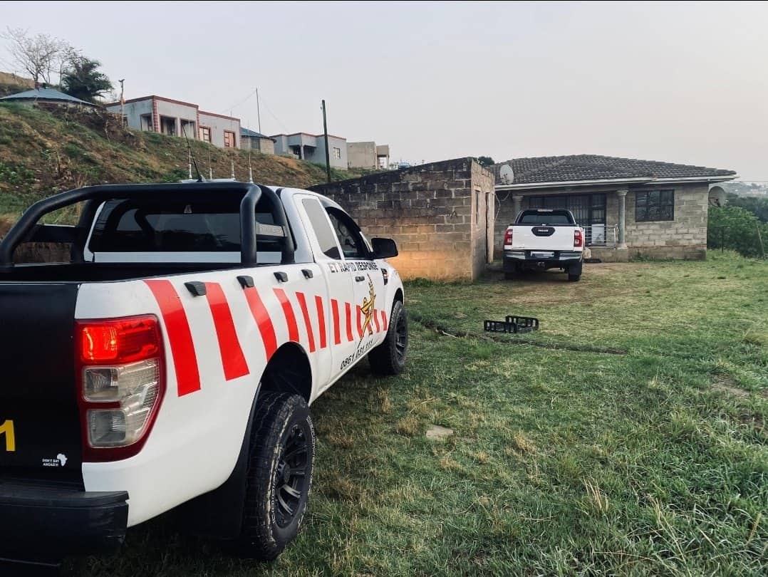 A security vehicle parked behind a stolen vehicle. 