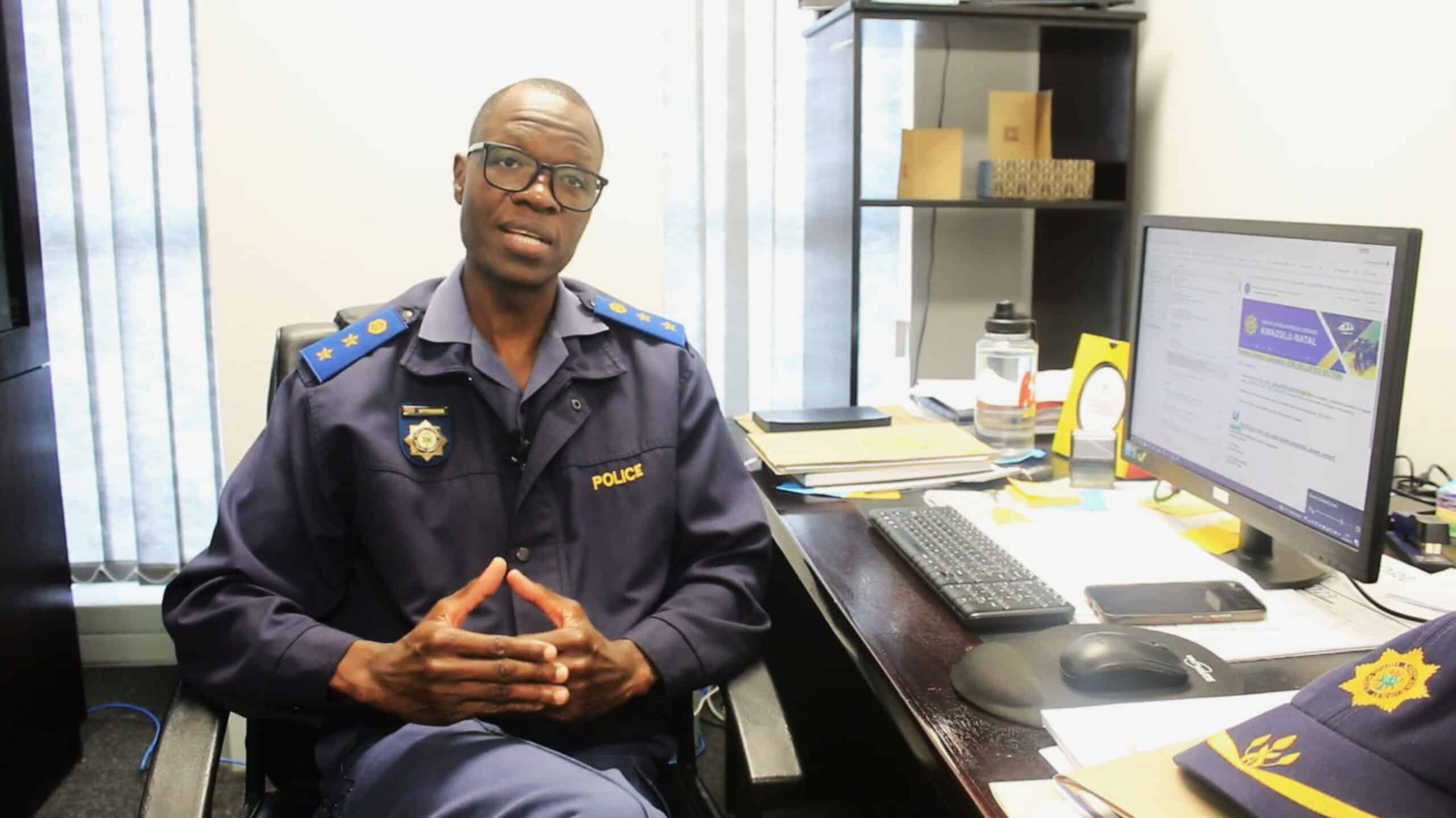 A police officer at his desk.