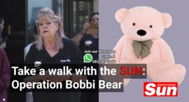 A picture of a woman talking and a plush animal.