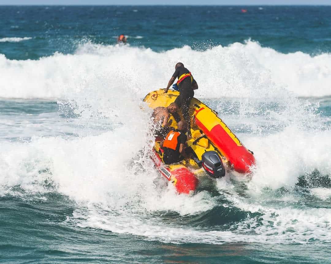 A lifeguard boat sailing out to sea.