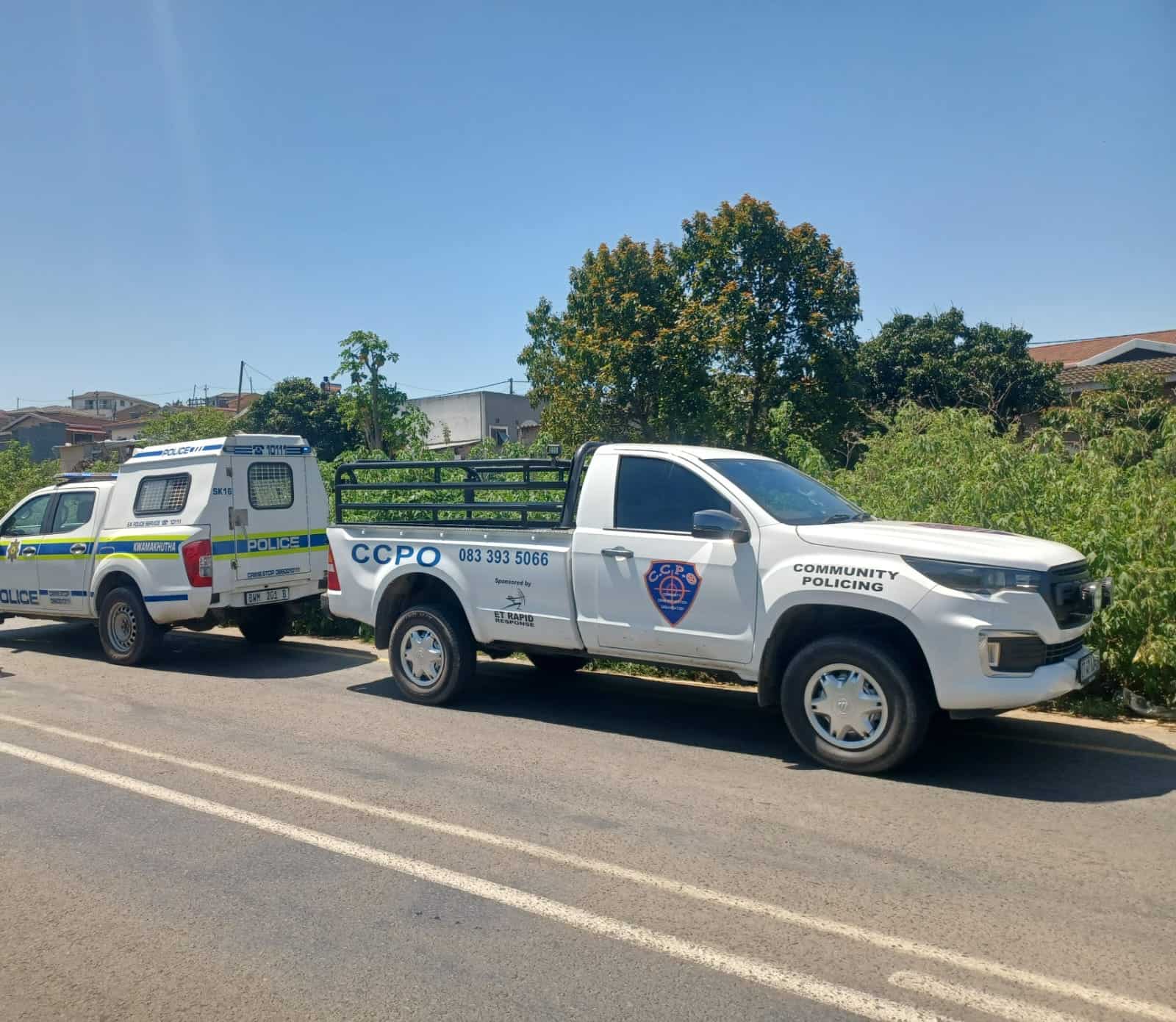 Two vehicles parked along the road.