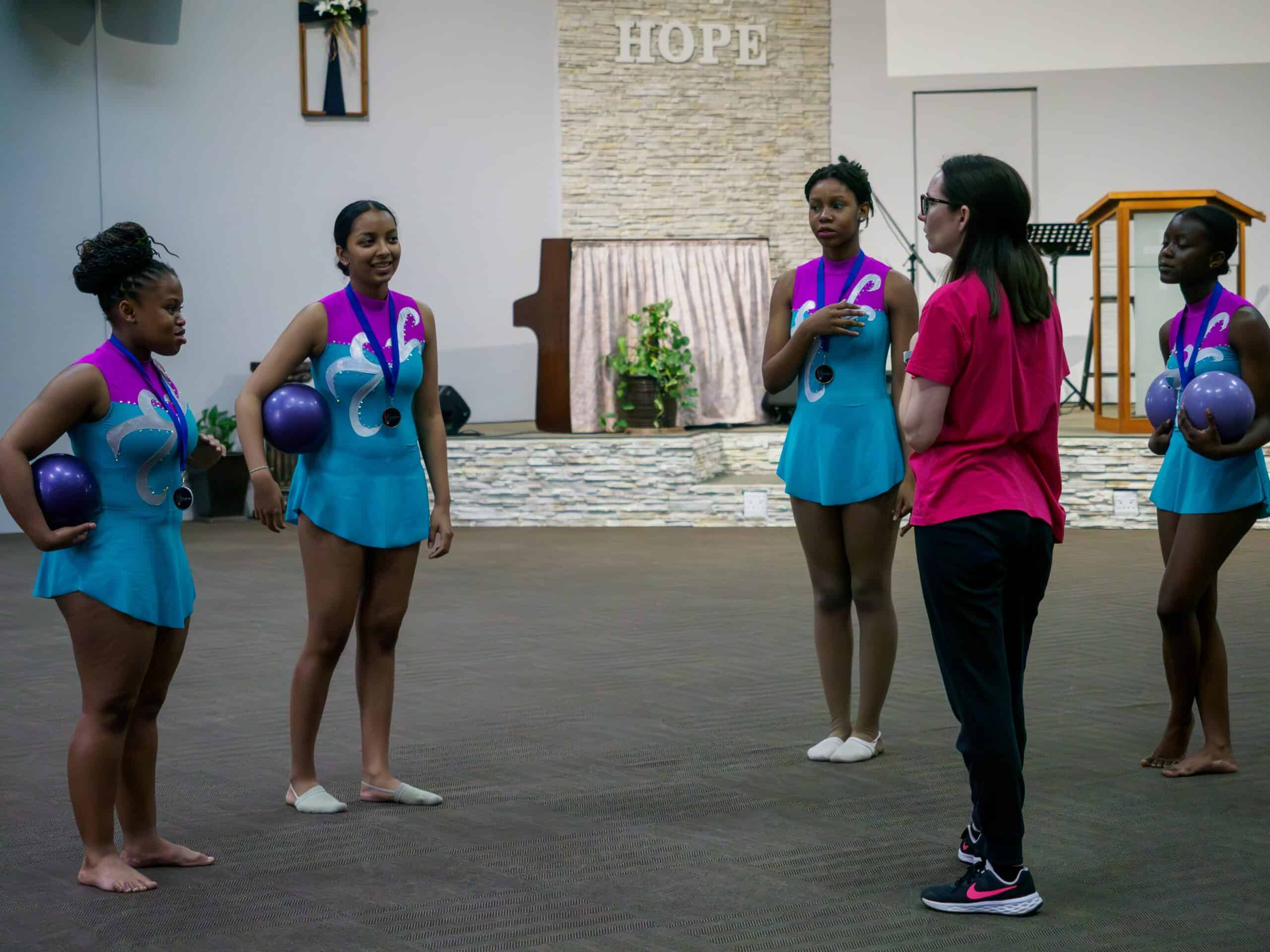 A gymnastics group and its club leader.