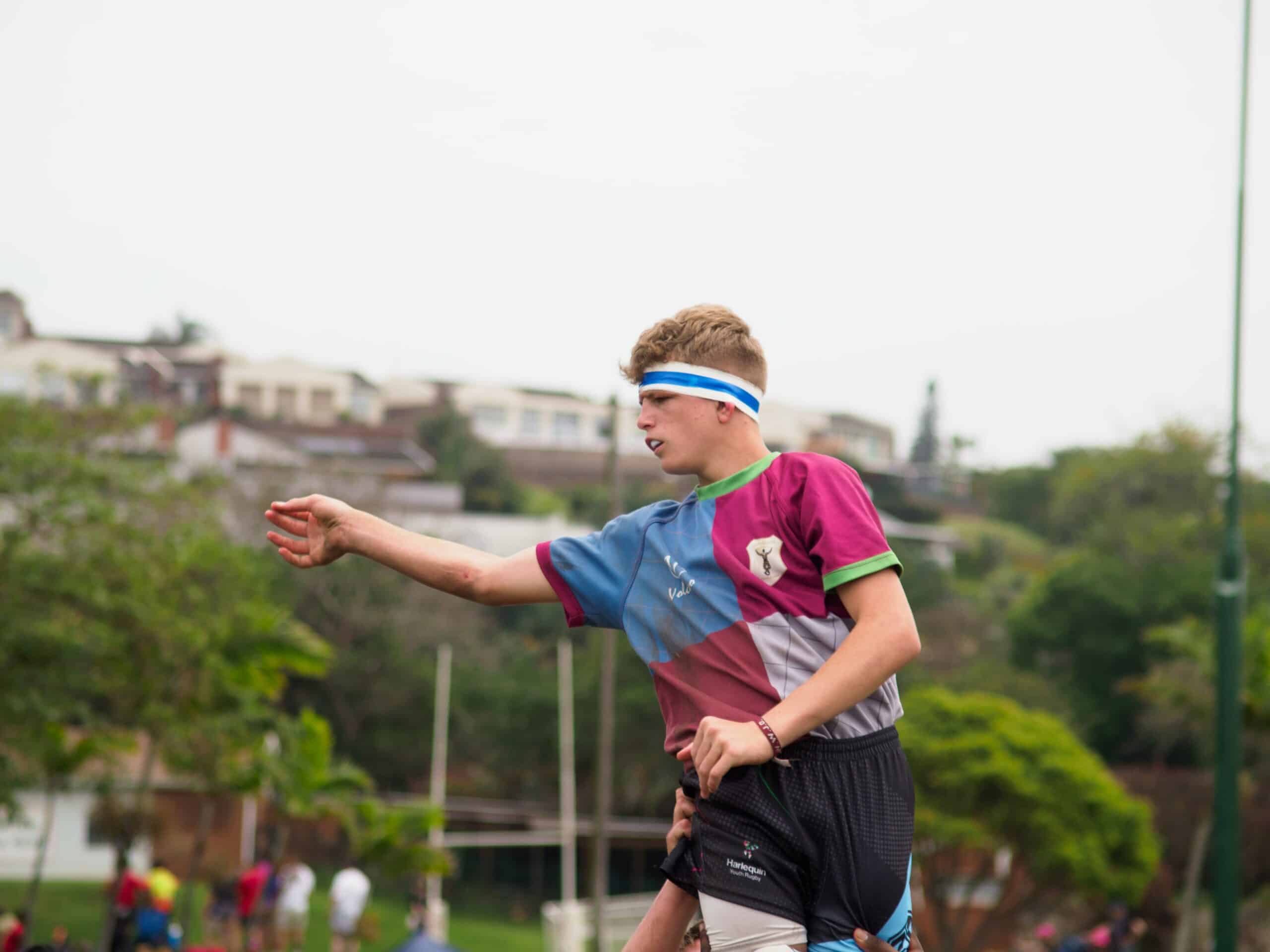 A rugby player after passing the ball.