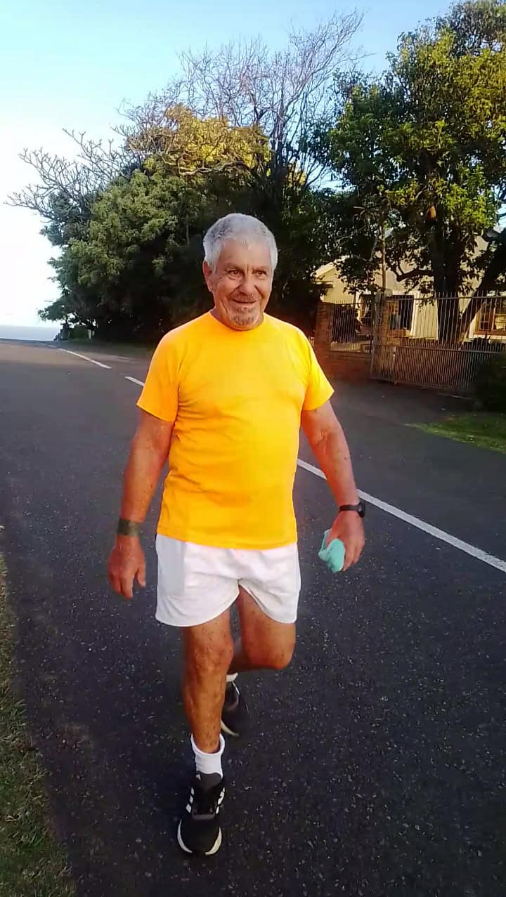 An elderly man walking. 