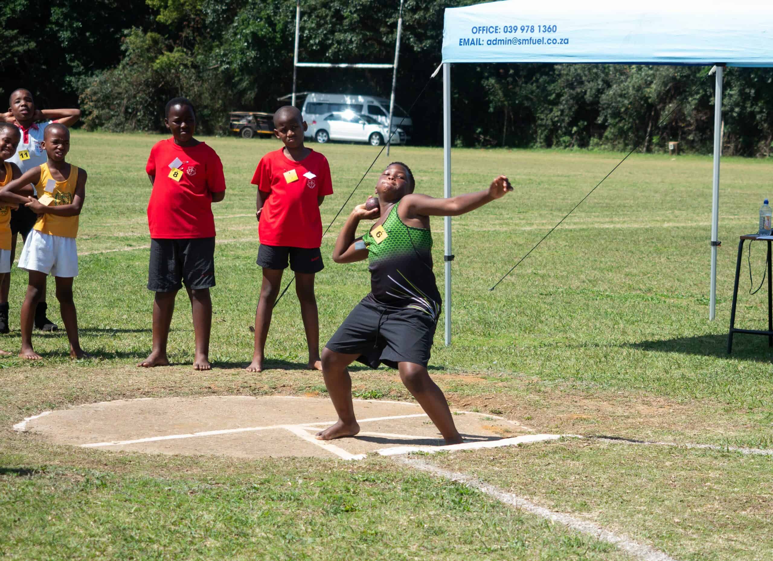 A child doing shot put.